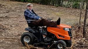Man riding lawn mower