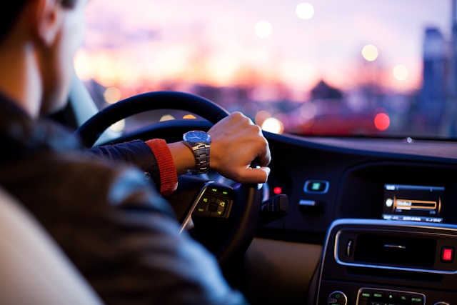 A person driving their car